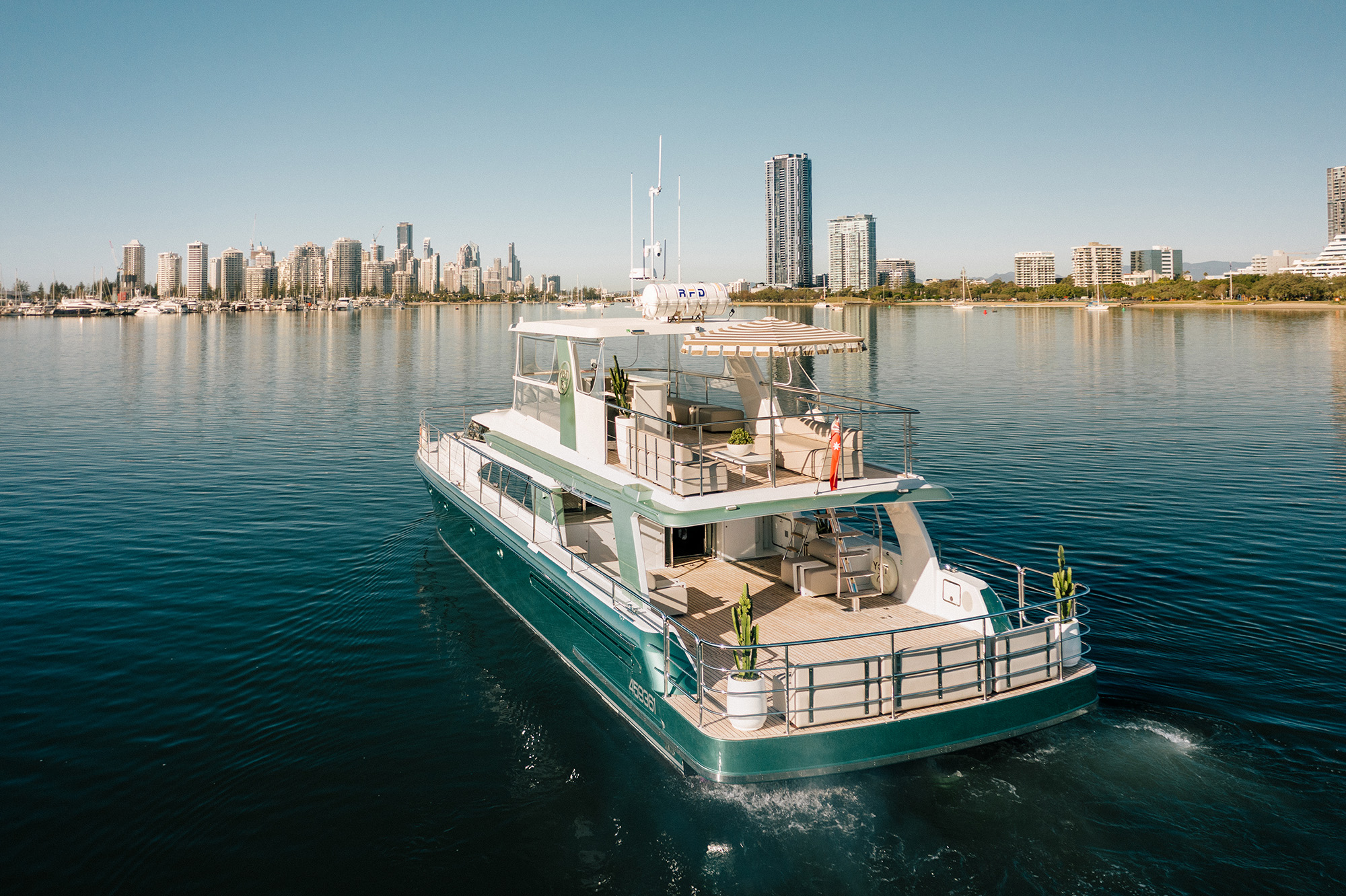 YOT 75 underway with the Gold Coast skyline beyond